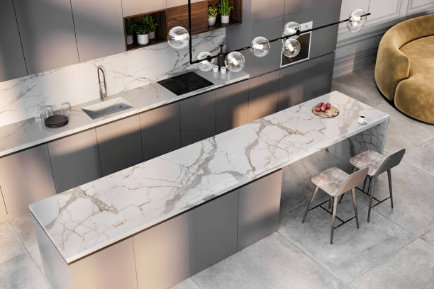 Large-format Calacatta porcelain slab countertop with dramatic marble-inspired veining in a contemporary kitchen.